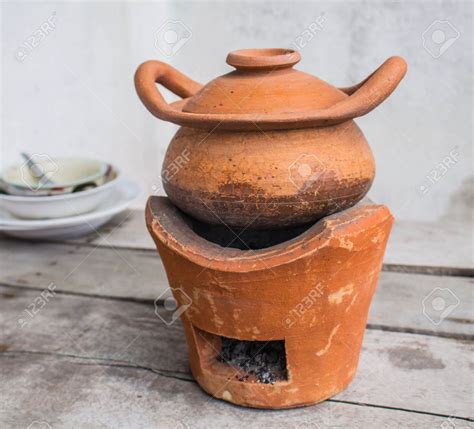 32771917 Set Oven And Traditional Clay Pot Cooking Stock Photo
