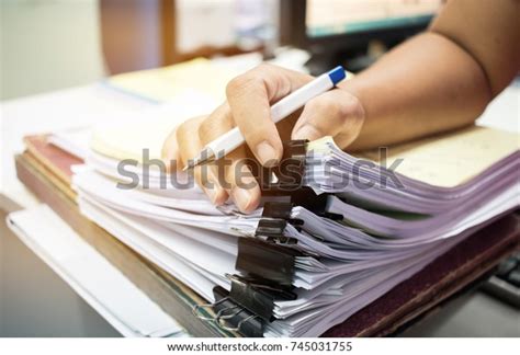 Businessman Hands Searching Unfinished Documents Stacks Stock Photo