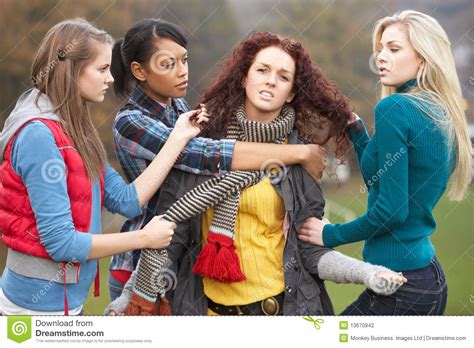 Bullying is not just physical, like hitting or kicking someone, or taking their things without permission. Group Of Female Teenagers Bullying Girl Royalty-Free Stock ...