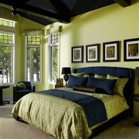 Think a colorful trio like purple, blue and green can't be used in an otherwise traditional bedroom? navy and green bedroom - green walls, beige floor, navy ...