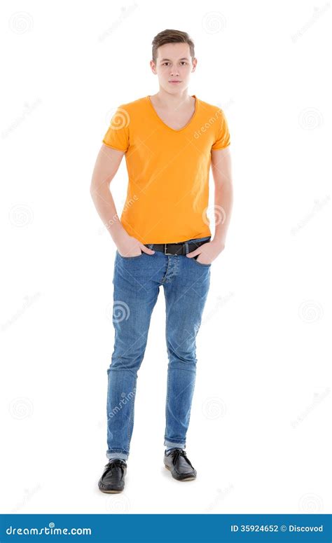 Young Man Wearing A Yellow T Shirt And Slim Jeans Stock Photo Image