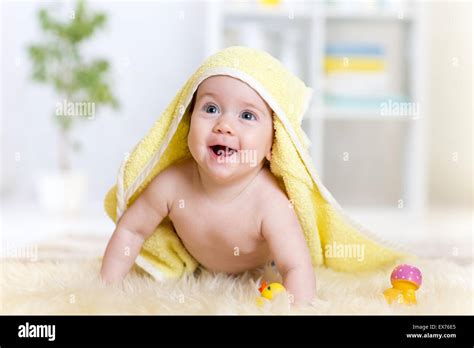 Cute Baby Lying On Fur Bed While Smiling Under Towel Stock Photo Alamy