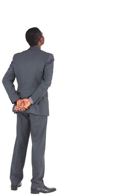 Premium Photo Businessman Standing With Hands Behind Back