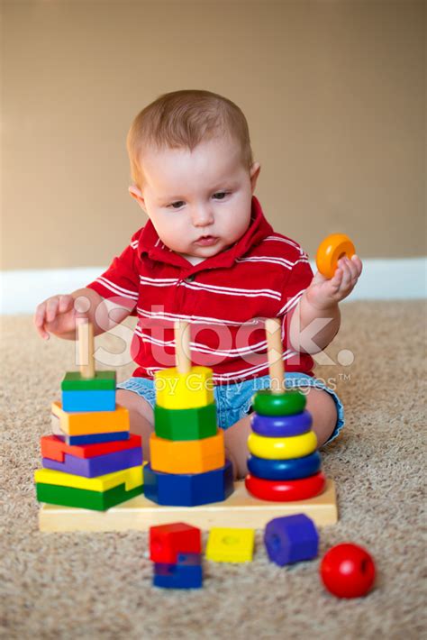 Baby Playing With Stacking Learning Toy Stock Photo Royalty Free