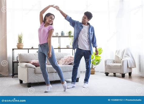 Romantic Teen African American Couple Dancing At Home Stock Photo
