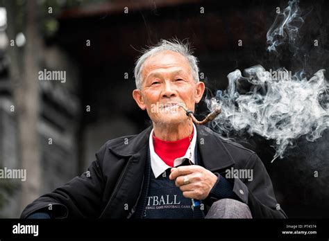Man Smoking Pipe China Hi Res Stock Photography And Images Alamy