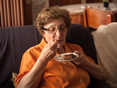 Older Lady Eating Cake