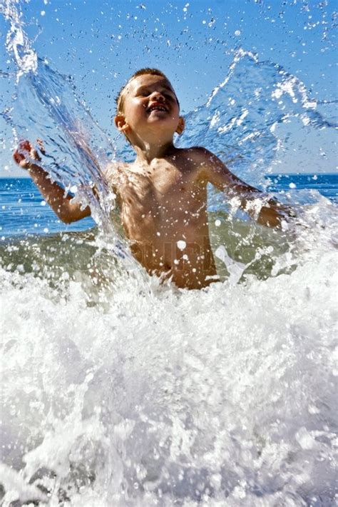 Children of the sea (film). Young child playing in the sea | Stock Photo | Colourbox