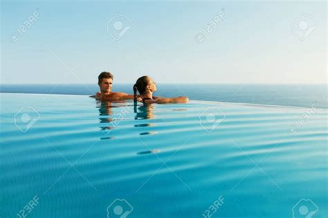 Couple In Love In Luxury Tourist On Romantic Summer Vacation People Relax Along The Edge Of The