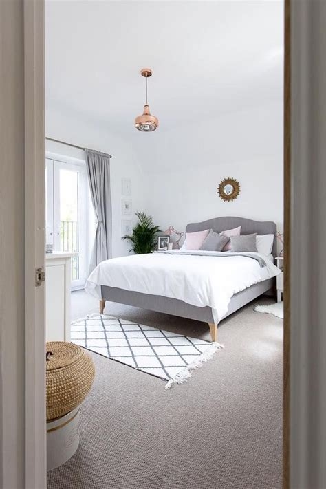 The modern flavor comes from this bedroom carpet. classic white and gray bedroom // copper pendant light ...
