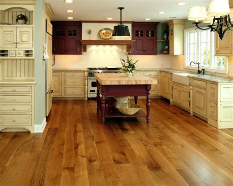 With lots of natural light, white cabinets, and a light color palette for the tile backsplash, the white oak helps amplify the bright, airy feel of the kitchen. Current Trends in Hardwood Flooring