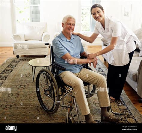 Her Care Lifts His Spirits Portrait Of A Smiling Caregiver And A