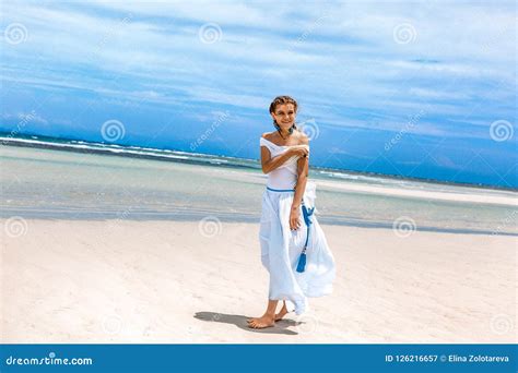 Beautiful Young Fashionable Woman In White Dress Walking By The Stock