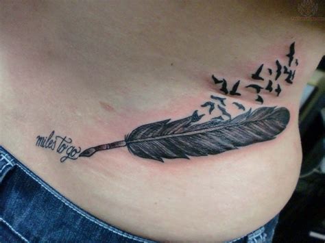 Feather Tattoo On Lower Back Raven Feather Tattoo On Lowerback View