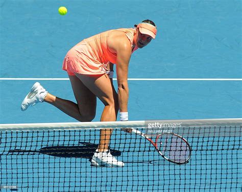 Russian Tennis Player Nadia Petrova Plays A Backhand Return During
