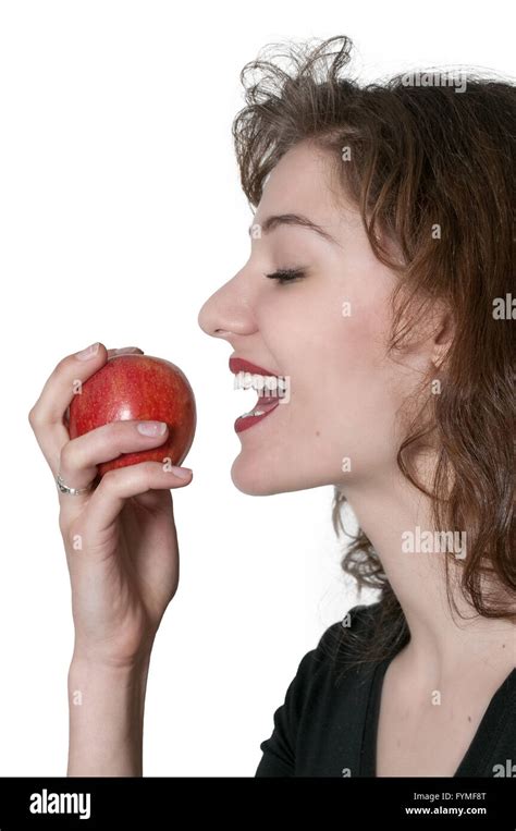 Woman Eating An Apple Stock Photo Alamy