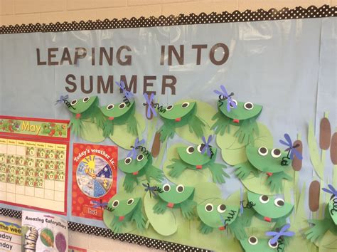 end of year bulletin board leaping into summer with frogs and dragonflies on lily pads with
