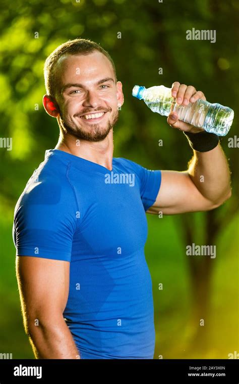 Athletic Mature Man Drinking Water From A Bottle Stock Photo Alamy