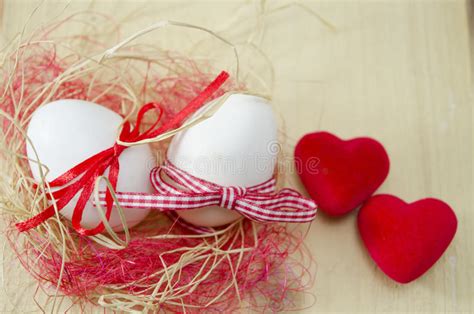 Two White Eggs In A Nest And Two Hearts Stock Image Image Of Eggs