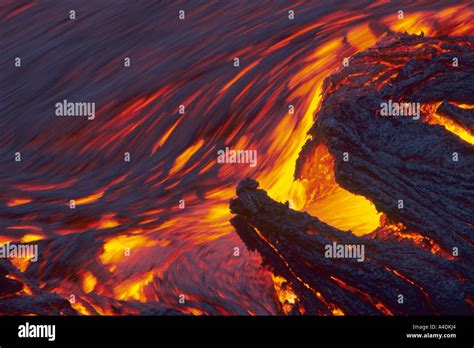 Molten Pahoehoe Lava Flowing At Night From The Erupting Kilauea Volcano
