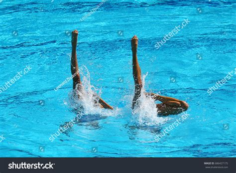 Synchronized Swimming Duet During Competition Stock Photo 686427175