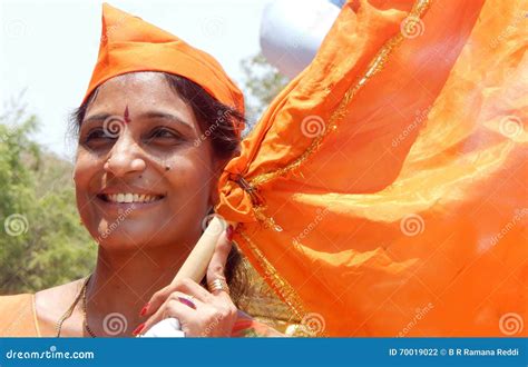 Portrait Of An Indian Hindu Woman Waving Saffron Flag Editorial