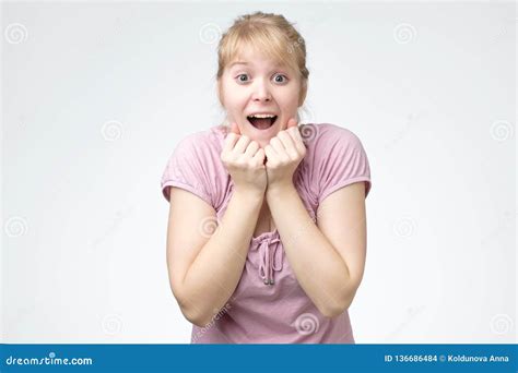 Young Woman Smiling Very Happy Surprised Holding Hands Near Head Being
