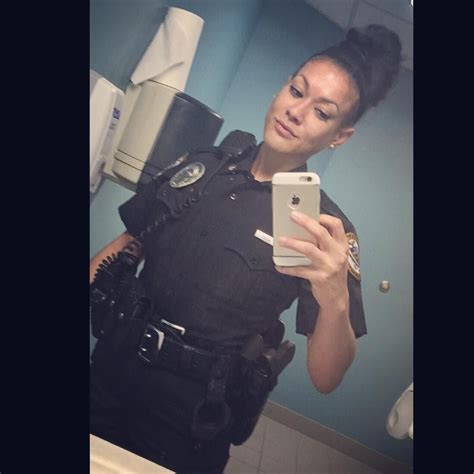 A Police Woman Taking A Selfie In The Bathroom