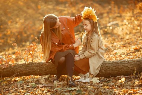 Happy Mother And Daughter In Autumn Forest · Free Stock Photo