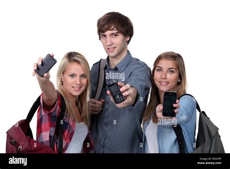 Teenagers Showing Mobile Phones Stock Photo Alamy