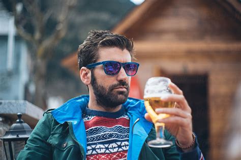 Young Man Drinking A Beer By Stocksy Contributor Javier Pardina