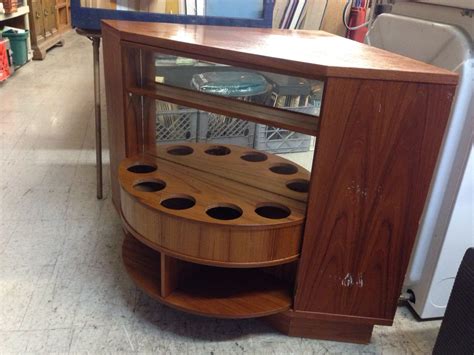 (via seattle staged to sell and design) Mid century hide away rotating corner bar / bookshelf just sold | Mid century, Decor, Midcentury ...