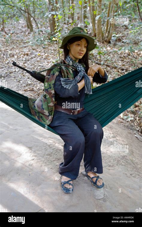 A Mannequin Of A Female Viet Cong Solider Sits In A Hammock In The Cu Chi Tunnels Exhibit In Ho