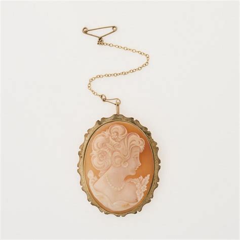 A Cameo Brooch Oval Shell Cameo With Carved Profile Featured