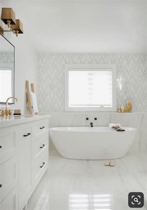 Trendy bathroom additions that bring home the luxury spa! Stand alone tub under window next to vanity. Larger window ...