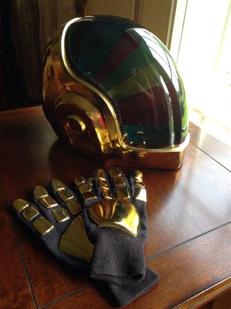 Daft punk after a synthesizer explosion in their home studio, the french duo that makes up daft punk discovered they had been turned into robots featuring shiny, stylised helmets. Guy Daft Punk Gold Helmet | helmet