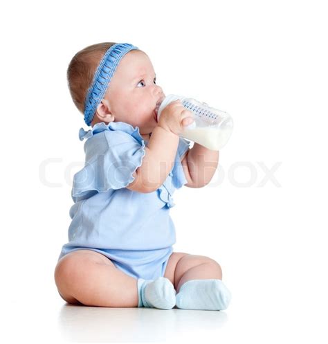 Adorable Baby Girl Drinking Milk From Bottle Without Help Stock Photo