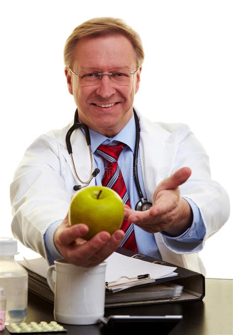 Doctor Pointing To an Apple Stock Photo - Image of happy, diet: 15444790
