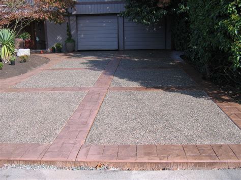 The Driveway Is Made Out Of Bricks And Gravel