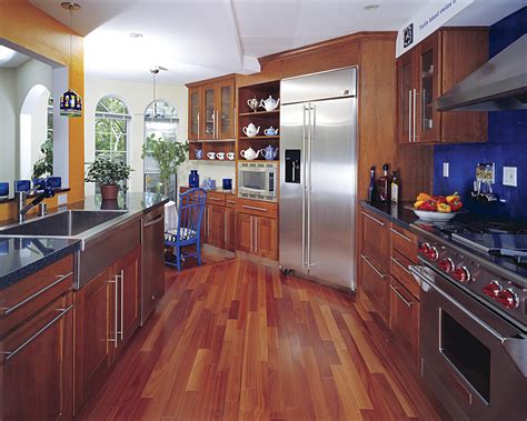 Both options are durable, resist kitchen spills and splashes, and are available in plenty of designs and textures. Hardwood Floor In a Kitchen - Is This Allowed?