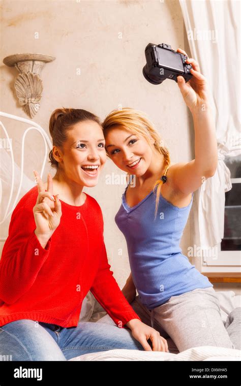 Two Girls Doing Themselves Photo In A Bedroom Stock Photo Alamy