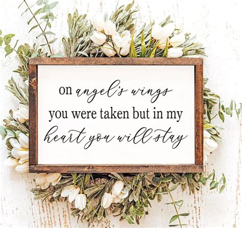 A Sign That Says On Angel Wings You Were Taken But In My Heart You Will