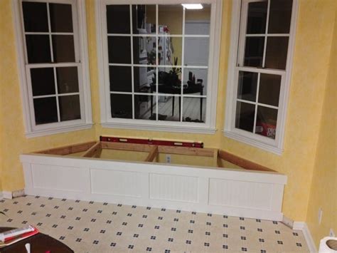 A diy window bench seat with 3 over sized storage areas underneath. DIY Window Seat with Storage