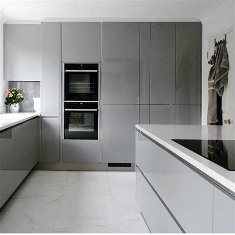 Gray and white kitchens are set to top trends charts for a while now and if you already have a kitchen in white, then adding a dash of gray to it is all you need to jump in on this cool bandwagon. Top 50 Best Grey Kitchen Ideas - Refined Interior Designs