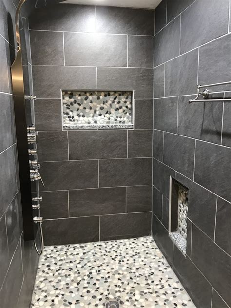 The variety of tile that make up this shower is impressive and interesting. 15 Shower Floor Ideas for the Perfect Bathroom - Housessive