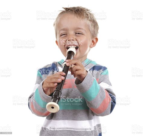 A Young Boy Playing The Recorder Stock Photo Download Image Now Istock