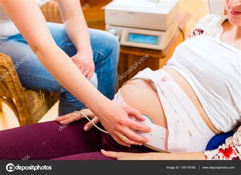 Midwife Seeing Mother For Pregnancy Ctg Examination Stock Photo By
