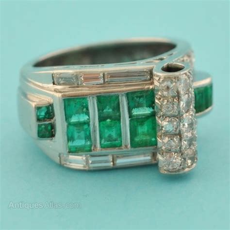 A radiant 1.84 carat emerald, set in a diamond encrusted art deco inspired 18k white gold band. Antiques Atlas - Art Deco Emerald Ring