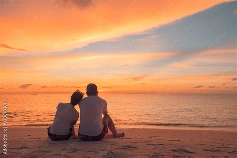 Couple In Love Watching Sunset Together On Beach Travel Summer Holidays