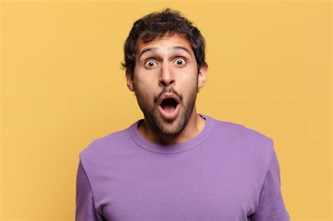 Premium Photo Young Handsome Indian Man Shocked Or Surprised Expression